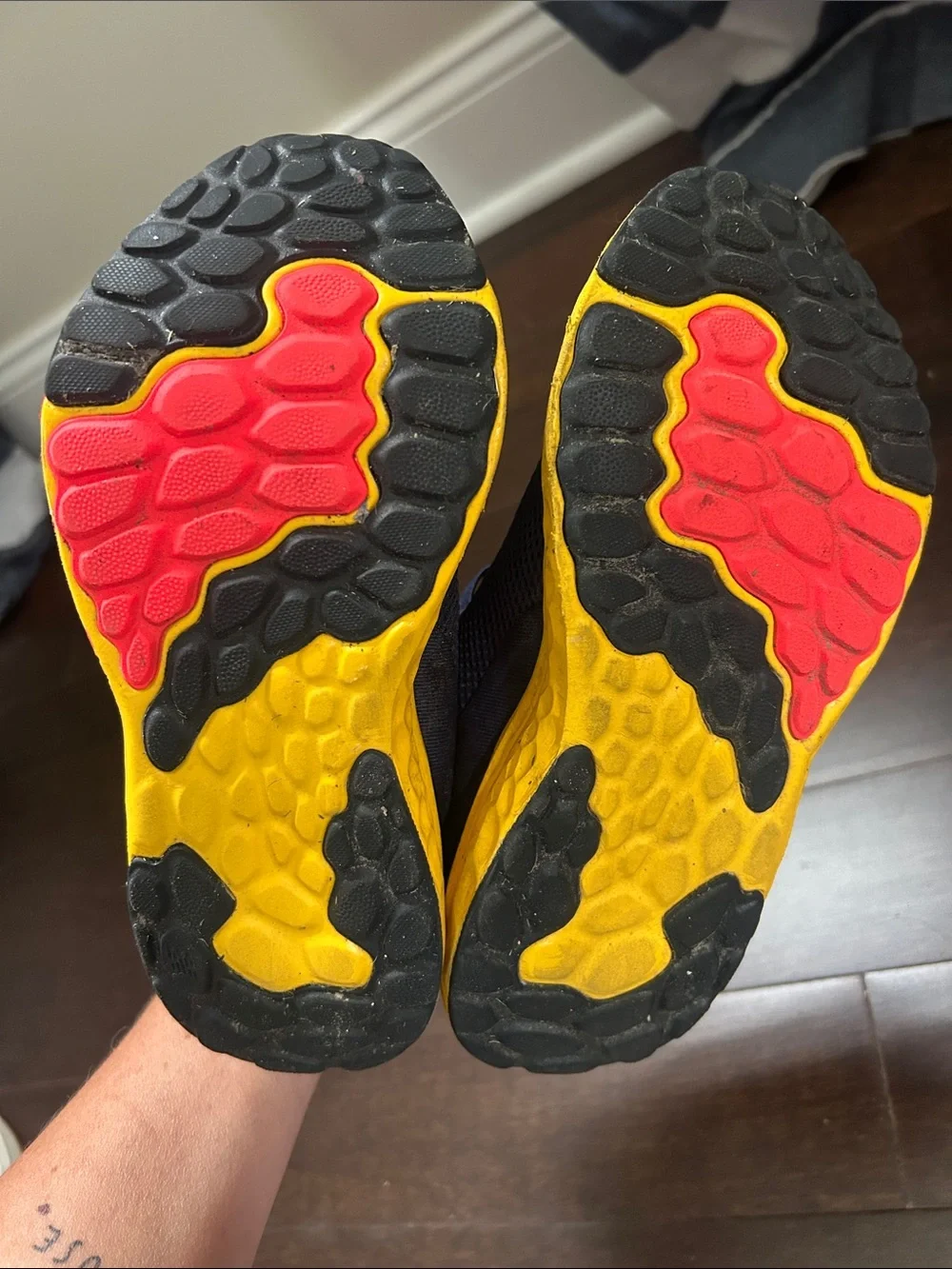 New Balance Kids Navy Sneakers with Yellow & Red Accents